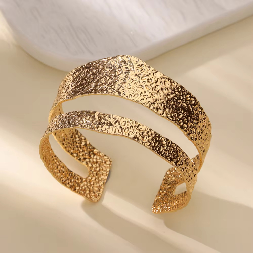 Elegant gold open bracelet with modern design