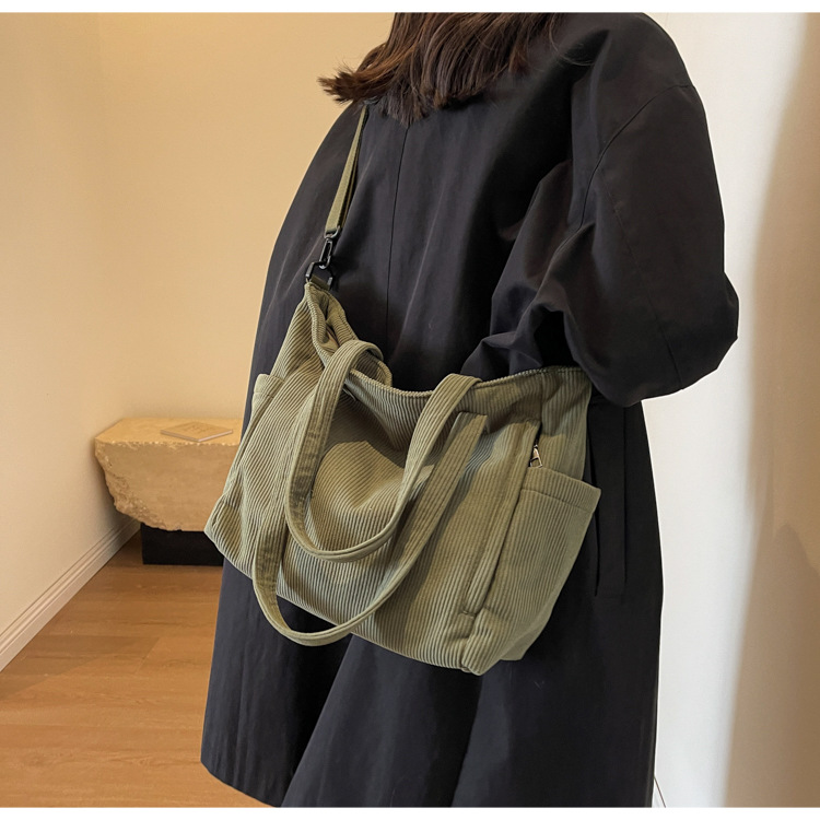 Large Capacity Art Student Shoulder Bag. Product information: Lining texture: Polyester, Applicable scenario: leisure travel, Color: creamy-white, green, black, Outer bag type: Sandwich pocket, Hardness: medium and soft, Material: corduroy, Suitcase shape