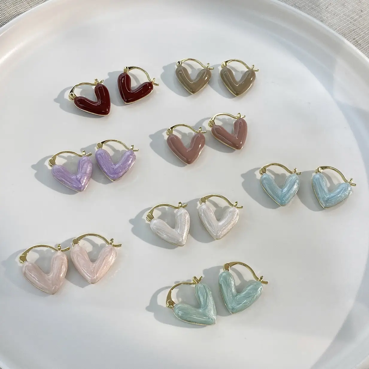 Female With Hearts Enamel Dripping White Earrings