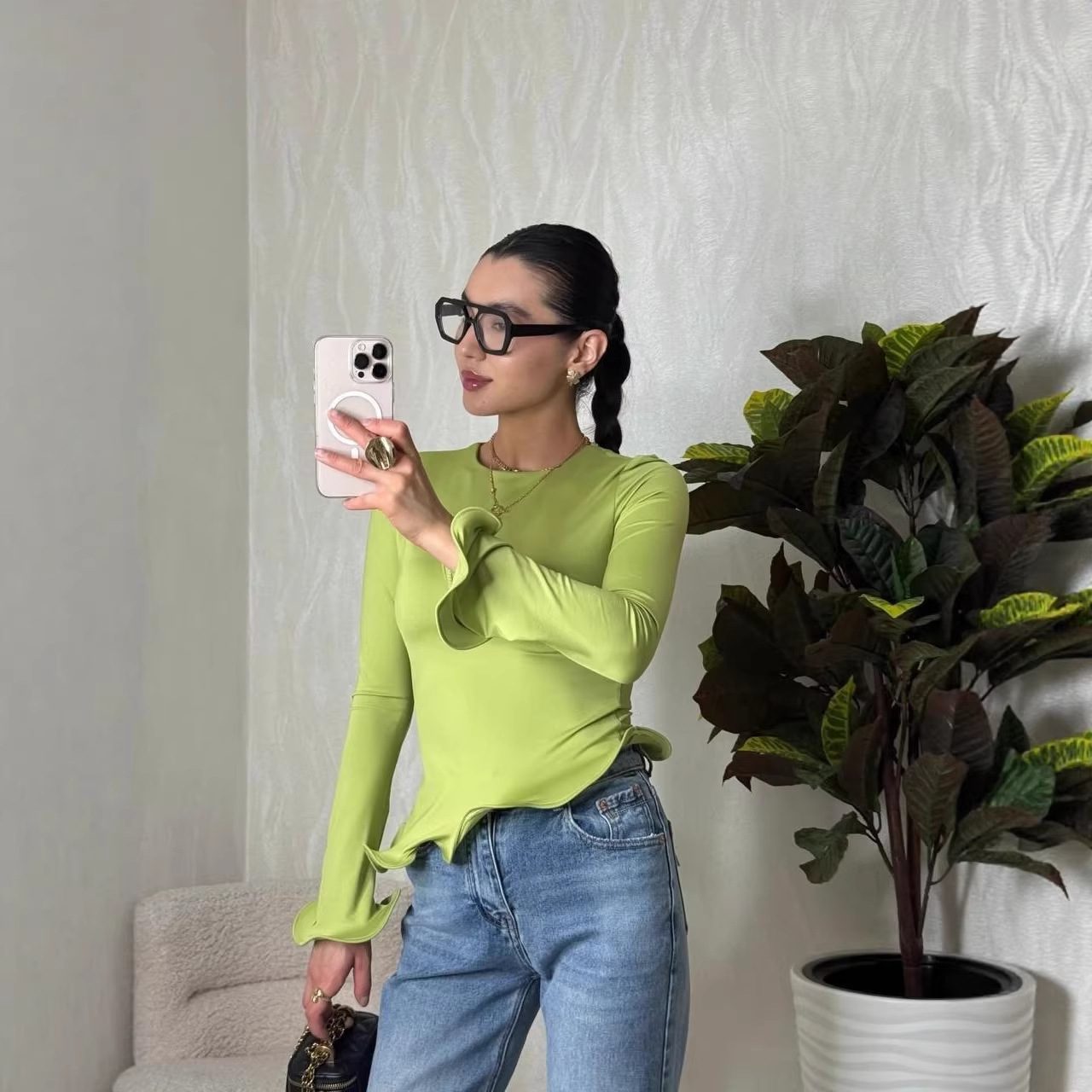 Crew-neck T-shirt With A Solid Color And An Asymmetrical Ruffled Hem