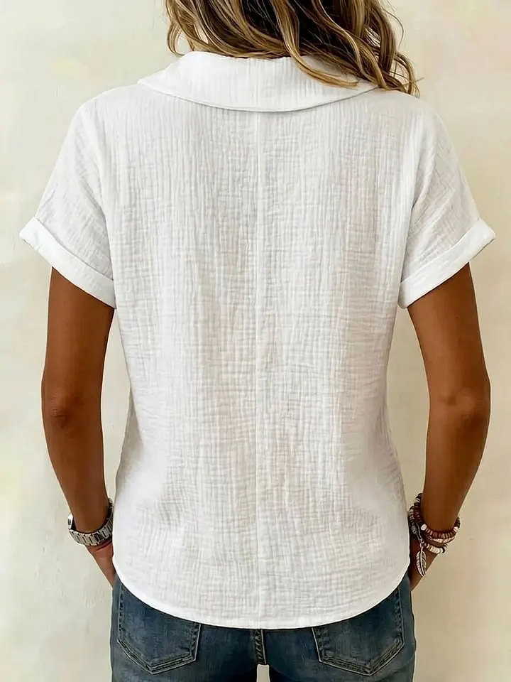 Women's butterfly collar knitted top in white, close-up of butterfly collar detail
