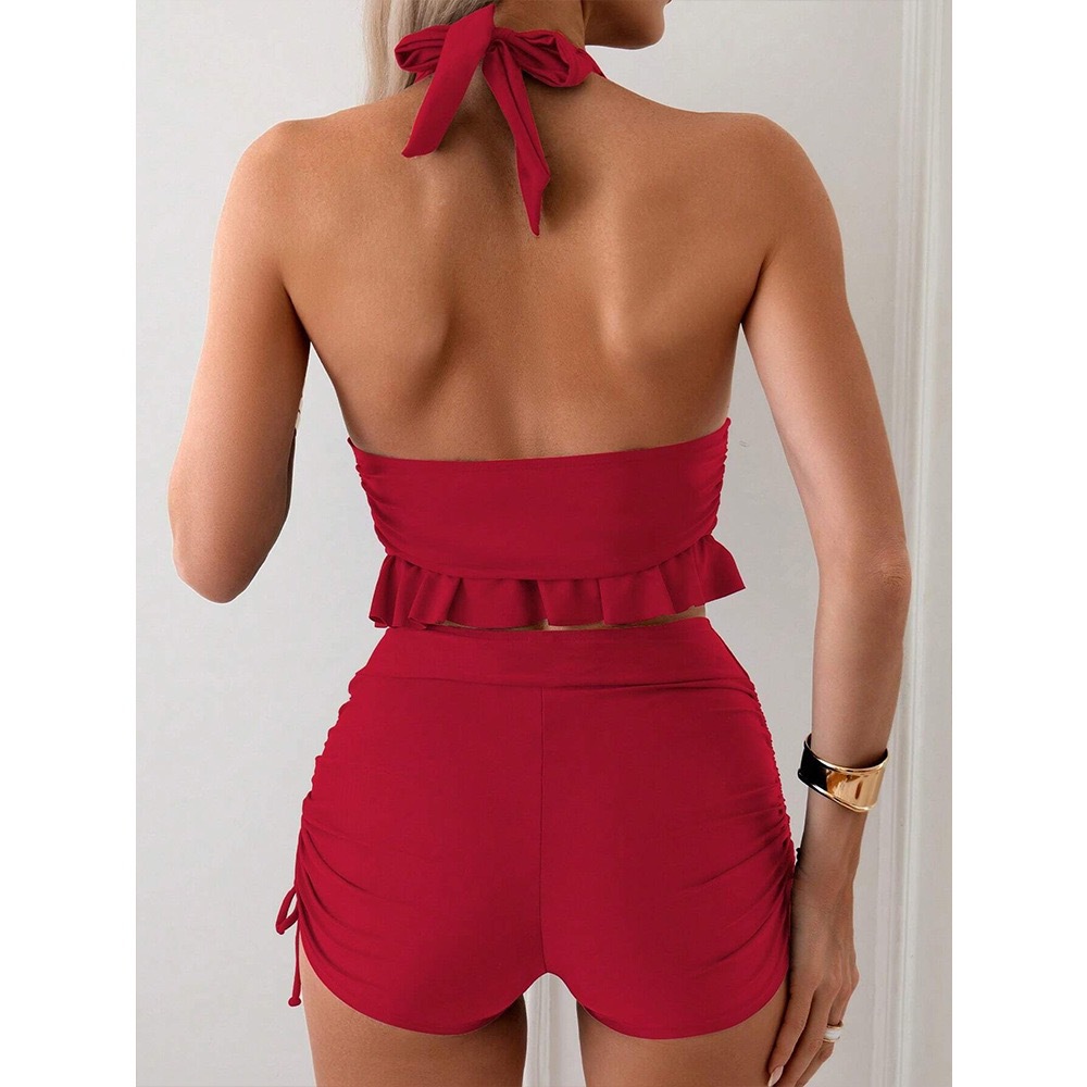 Ruffle bikini set in black, close-up of lace-up front detail and ruffle neckline