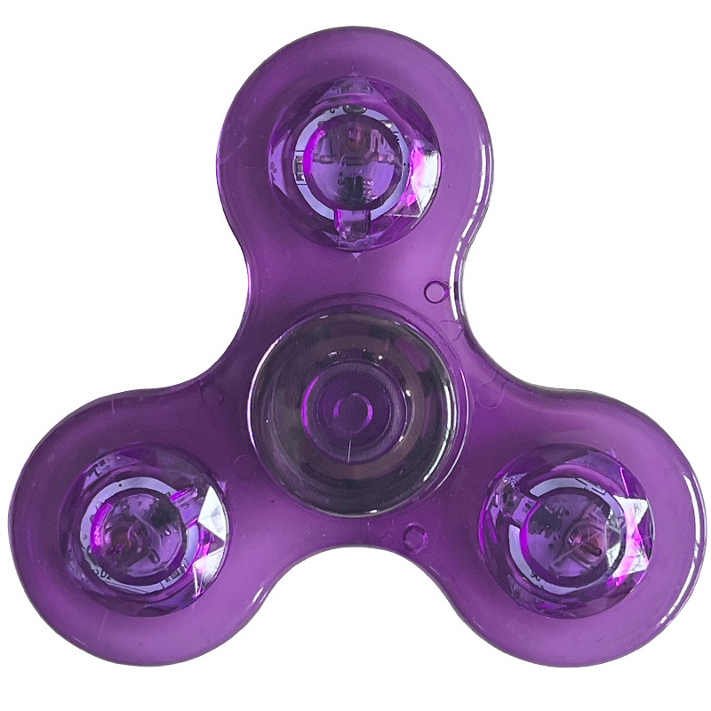 Rotating fingertip gyroscope glowing plastic (transparent
