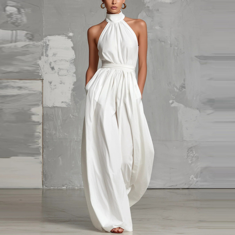 Women's belted pleated jumpsuit styled for work – high-waist cinched sleeveless elegant