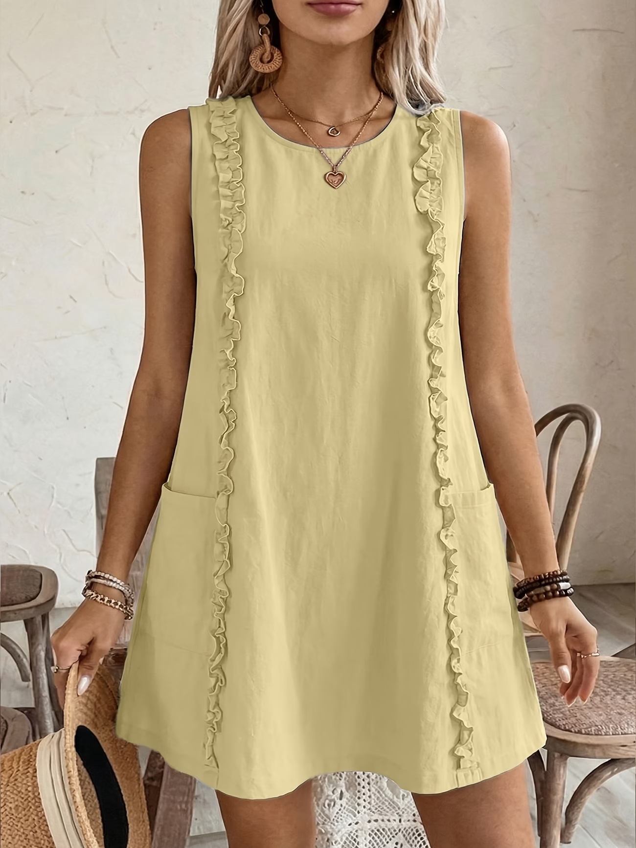 Women's solid color ruffle dress in yellow – editorial view