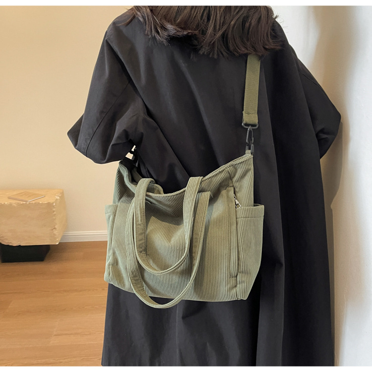 Large Capacity Art Student Shoulder Bag. Product information: Lining texture: Polyester, Applicable scenario: leisure travel, Color: creamy-white, green, black, Outer bag type: Sandwich pocket, Hardness: medium and soft, Material: corduroy, Suitcase shape