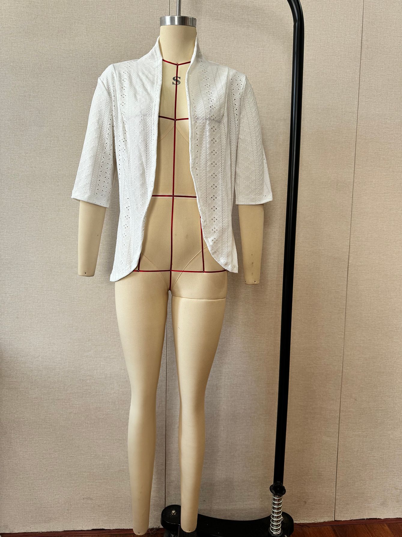 Eyelet hollow-out blazer jacket – size and fit reference on model showing loose fit silhouette