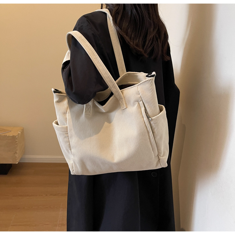 Large Capacity Art Student Shoulder Bag. Product information: Lining texture: Polyester, Applicable scenario: leisure travel, Color: creamy-white, green, black, Outer bag type: Sandwich pocket, Hardness: medium and soft, Material: corduroy, Suitcase shape