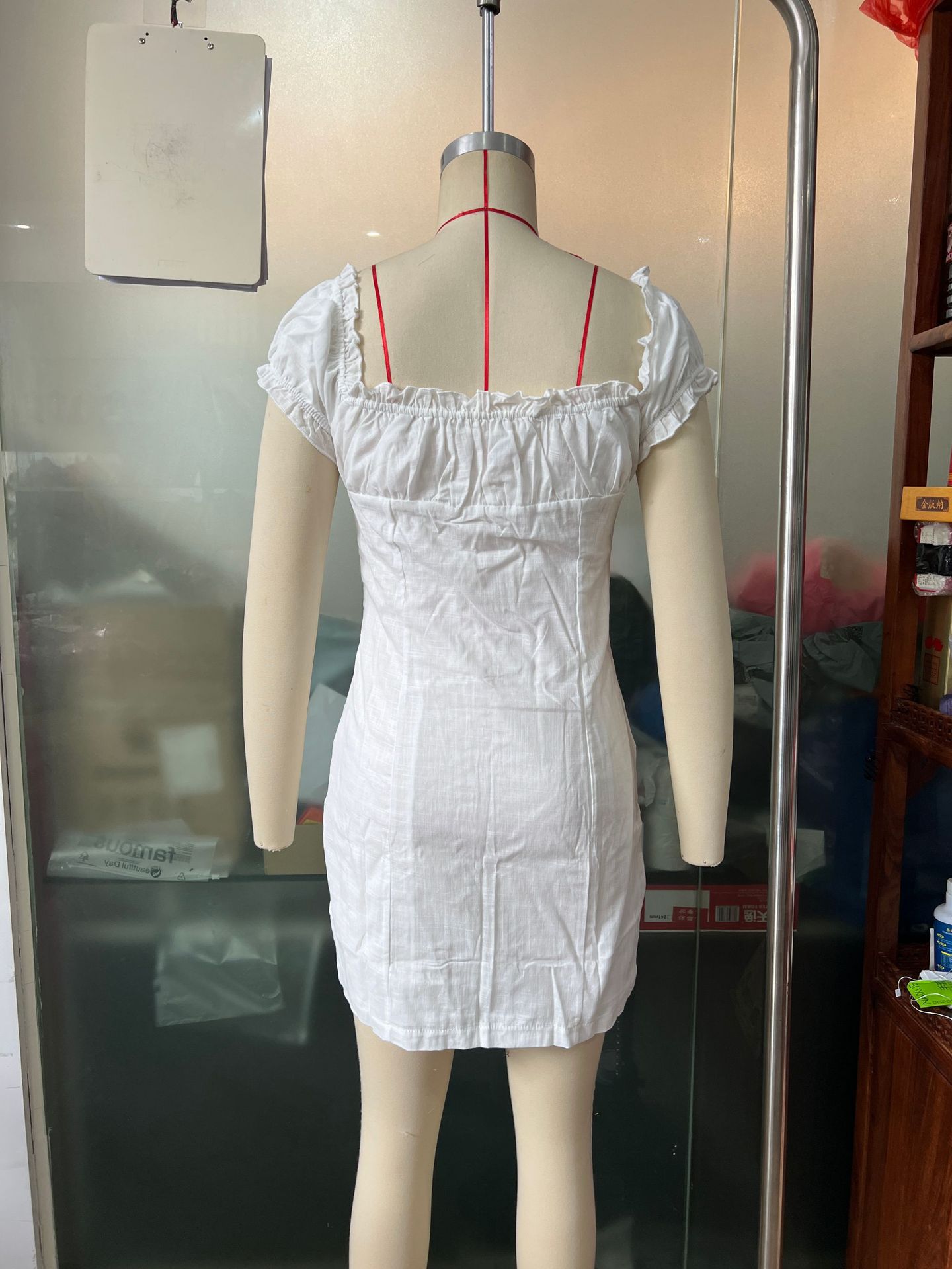 Women's lace-up puff-sleeve dress in white, full outfit view showing romantic feminine look