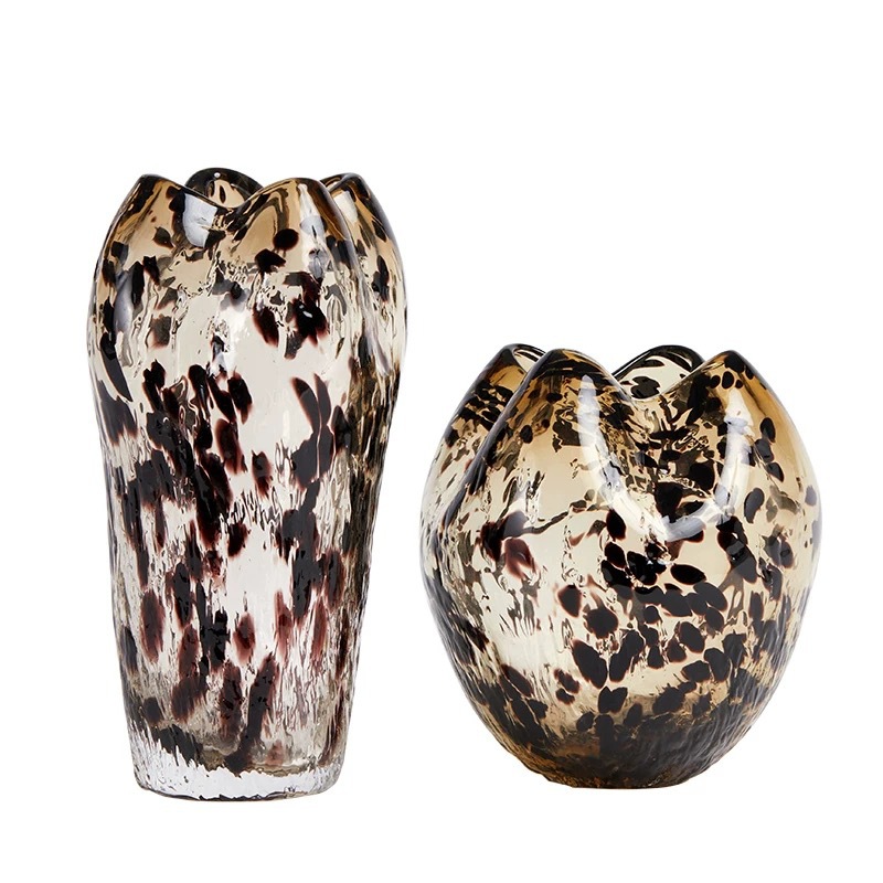 A Variety Of Modern Glass Vases And Floral Arrangements For Showroom Displays And Home Decor