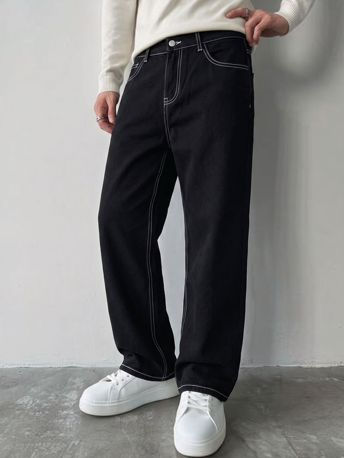 Men's Black Loose Straight-Leg Jeans with Contrast Stitching - front view showing waistband, pockets and contrasting seams