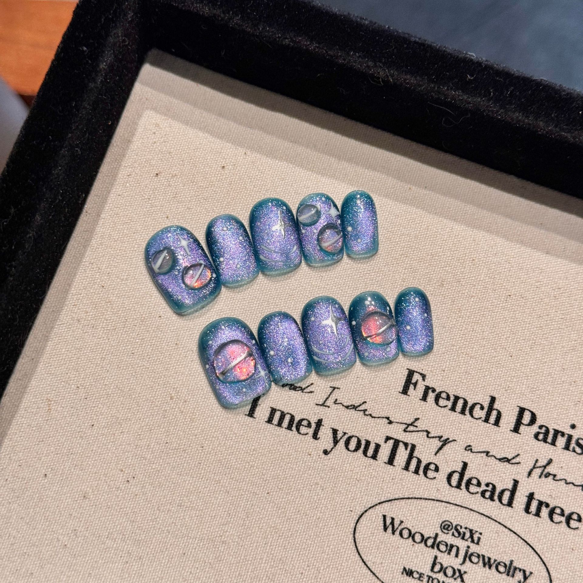 Hand-painted Wearable Nail Art Featuring A Blue Starry Sky And Nebula Design