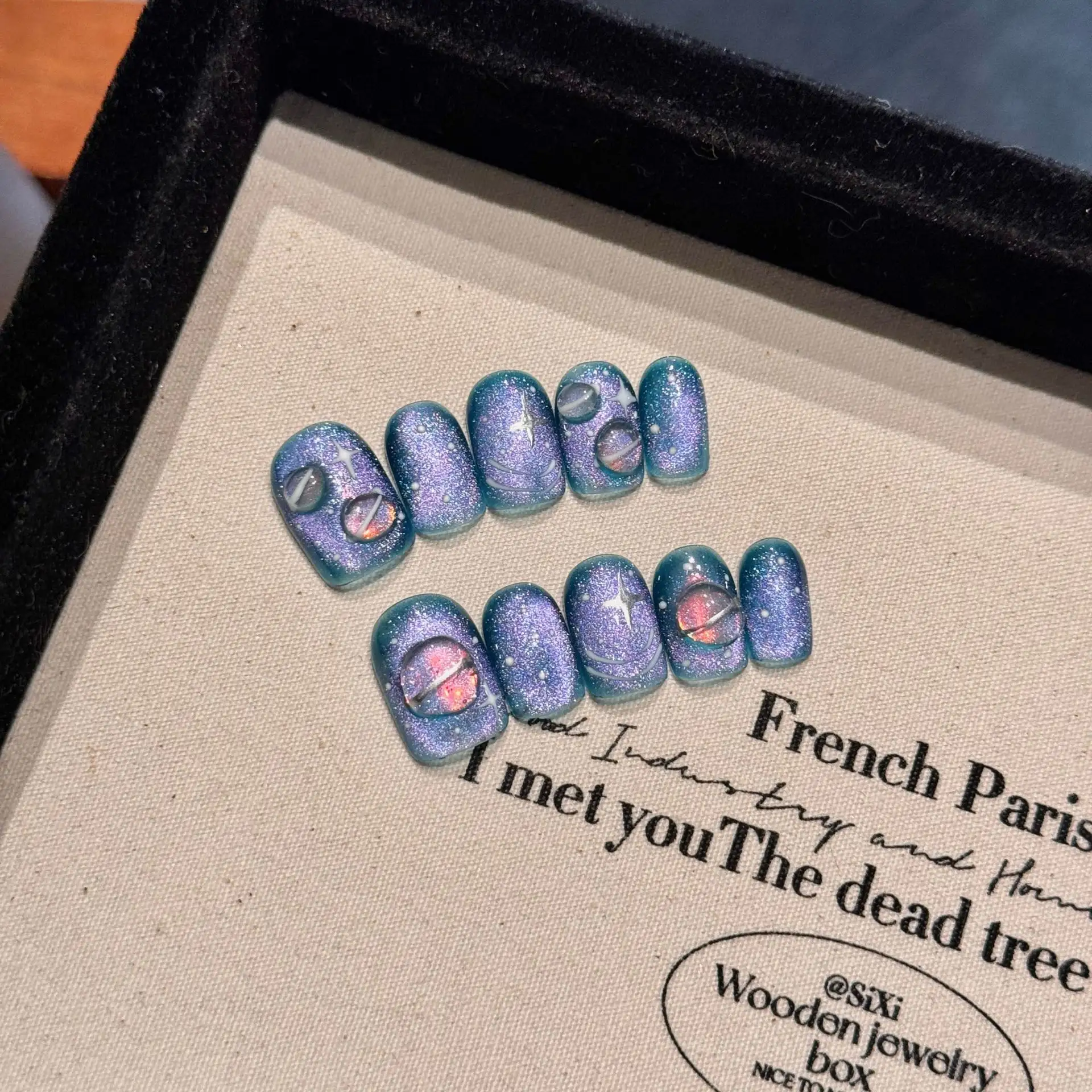 Hand-painted Wearable Nail Art Featuring A Blue Starry Sky And Nebula Design
