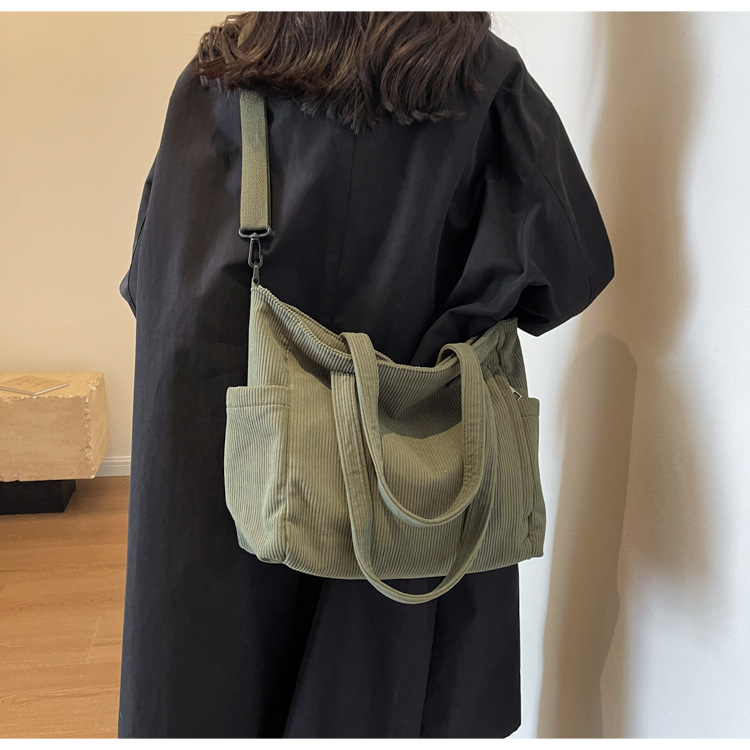 Large Capacity Art Student Shoulder Bag. Product information: Lining texture: Polyester, Applicable scenario: leisure travel, Color: creamy-white, green, black, Outer bag type: Sandwich pocket, Hardness: medium and soft, Material: corduroy, Suitcase shape