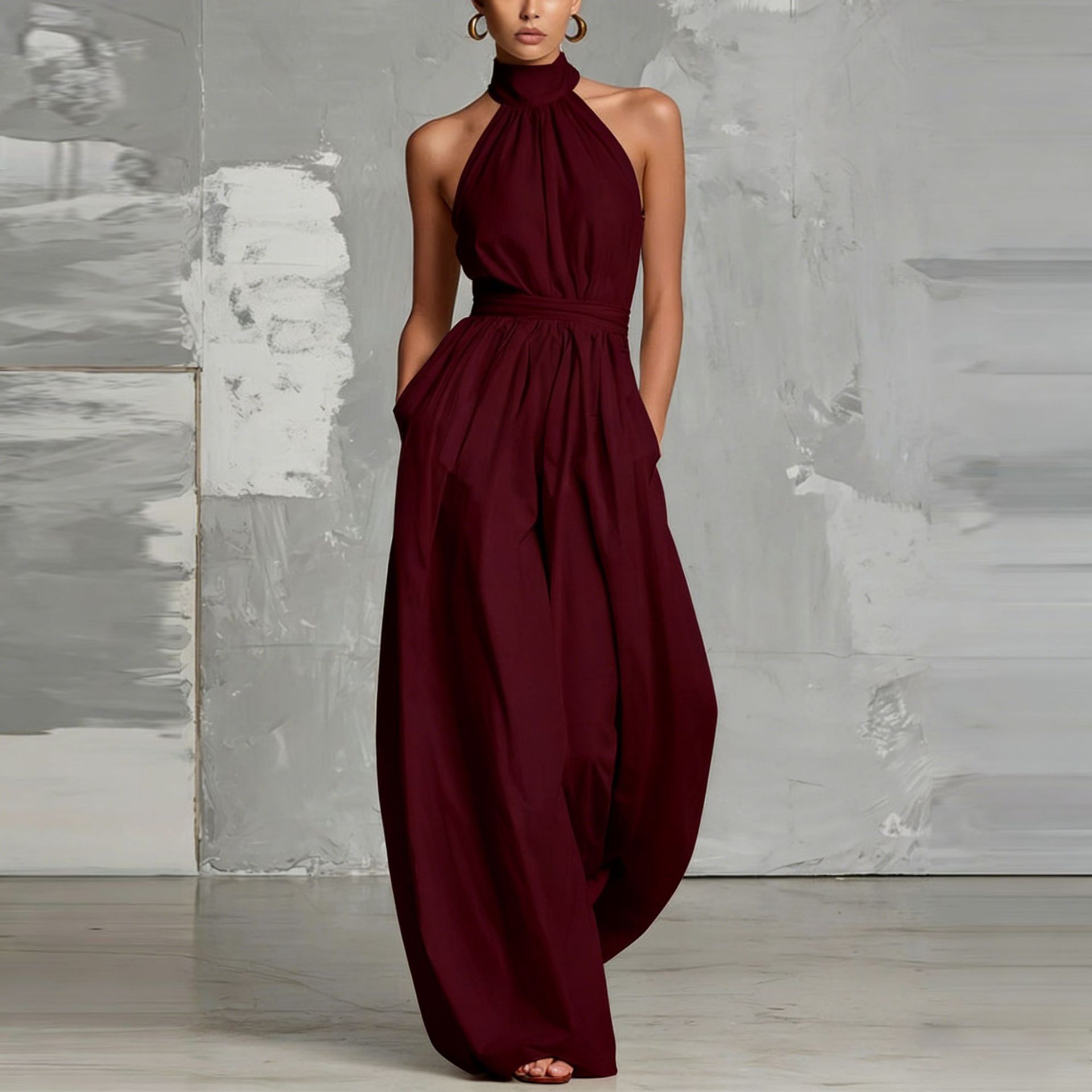 Women's belted pleated jumpsuit in dark blue – high-waist cinched sleeveless elegant