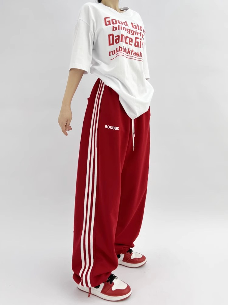 Patchwork athletic sweatpants, model wearing outdoor lifestyle photo