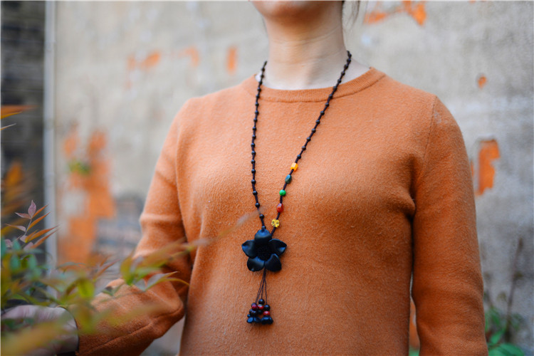 Title 3, Long sweater chain cowhide flower pendant