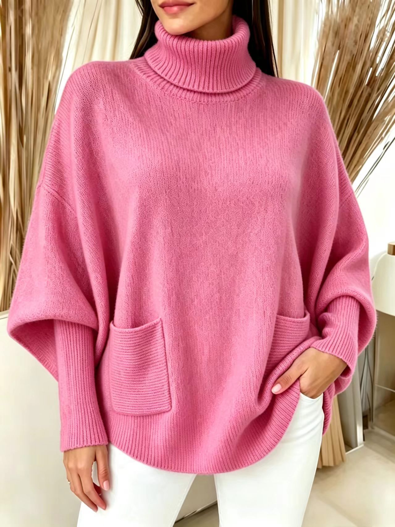 Women's oversized turtleneck sweater – editorial shot showing full batwing silhouette