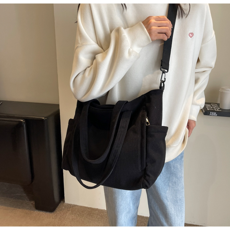 Large Capacity Art Student Shoulder Bag. Product information: Lining texture: Polyester, Applicable scenario: leisure travel, Color: creamy-white, green, black, Outer bag type: Sandwich pocket, Hardness: medium and soft, Material: corduroy, Suitcase shape