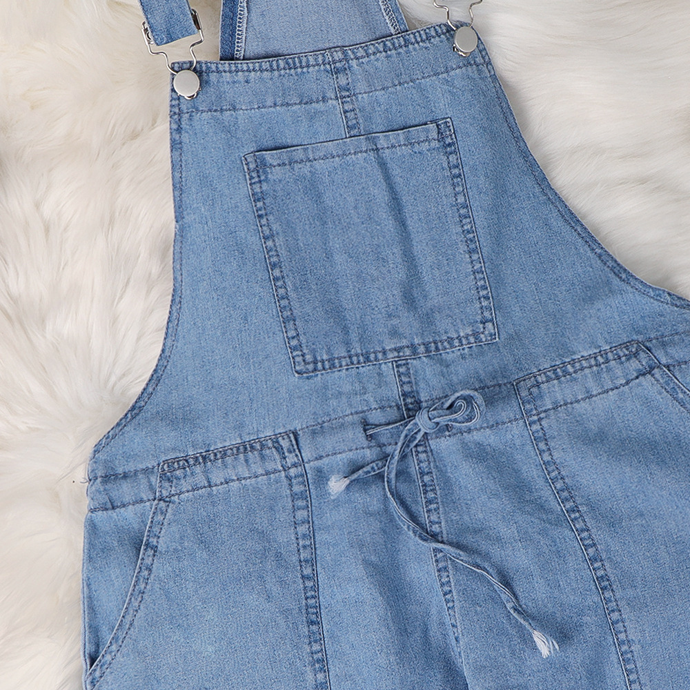 Women's cotton wide-leg overalls – fabric and strap detail close-up