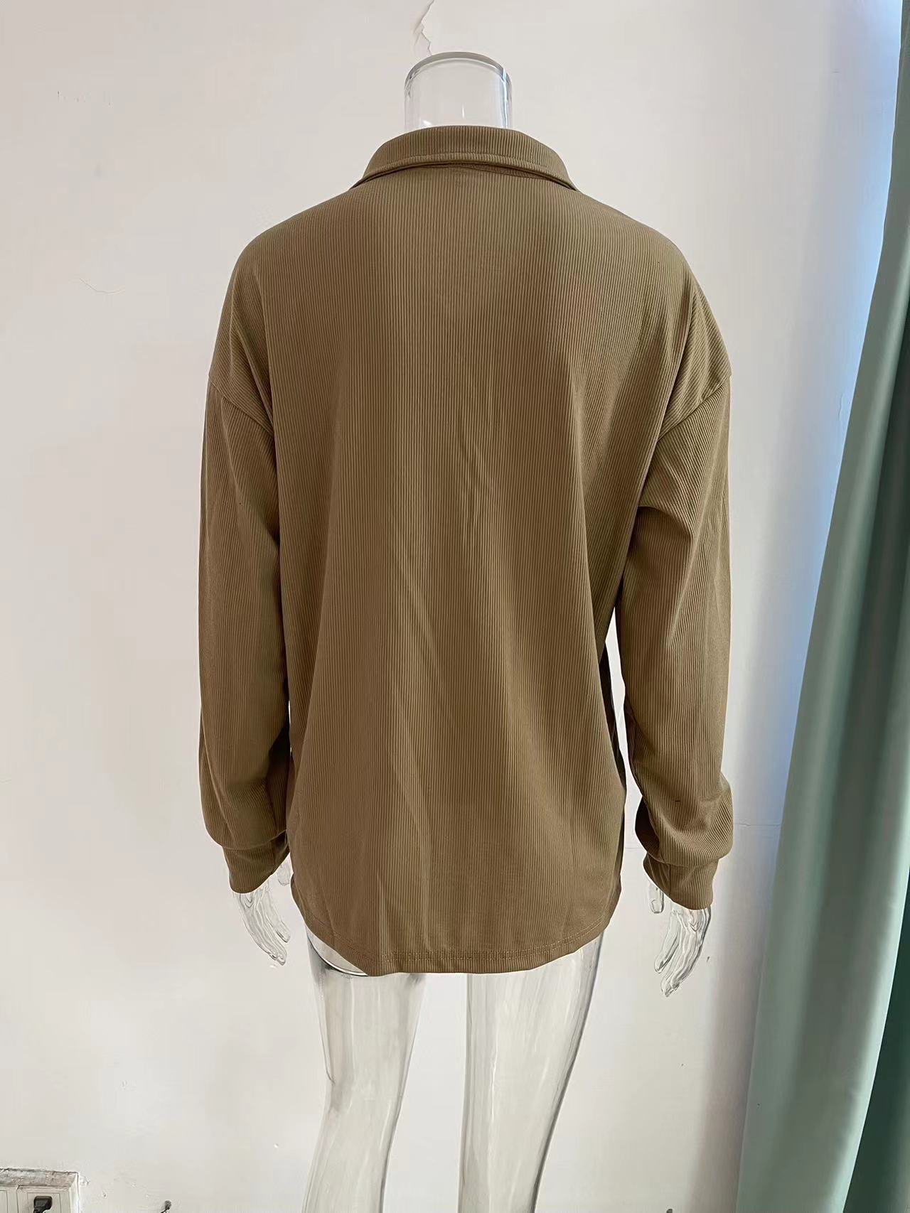 Women's loose long sleeve top styled with trousers – casual chic outfit