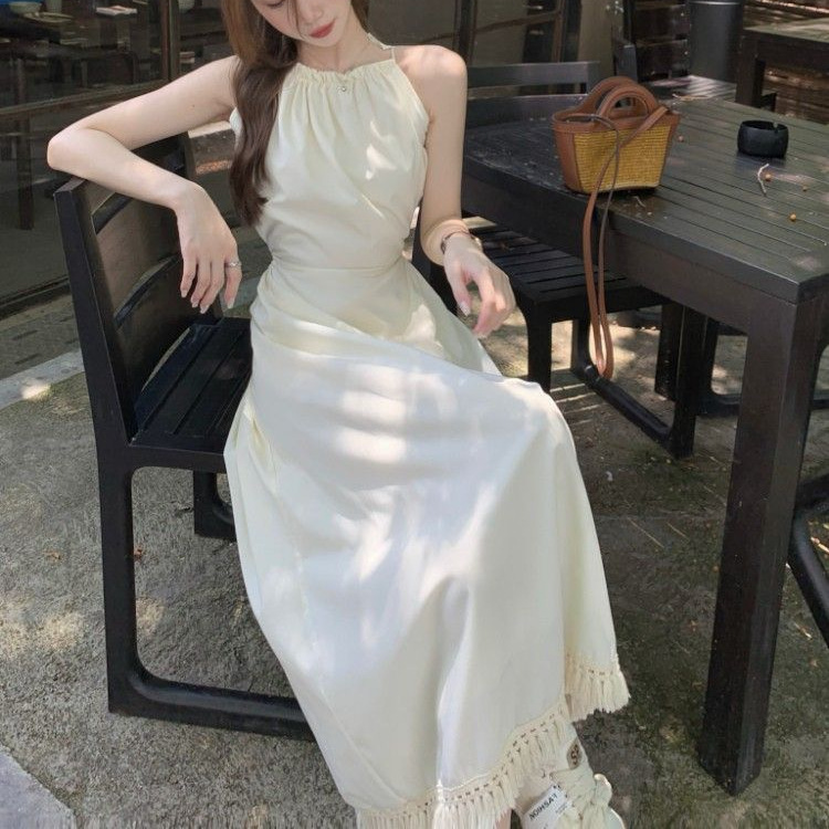 Halter-neck Slip Dress With A Cutout Back And Tassel Detailing