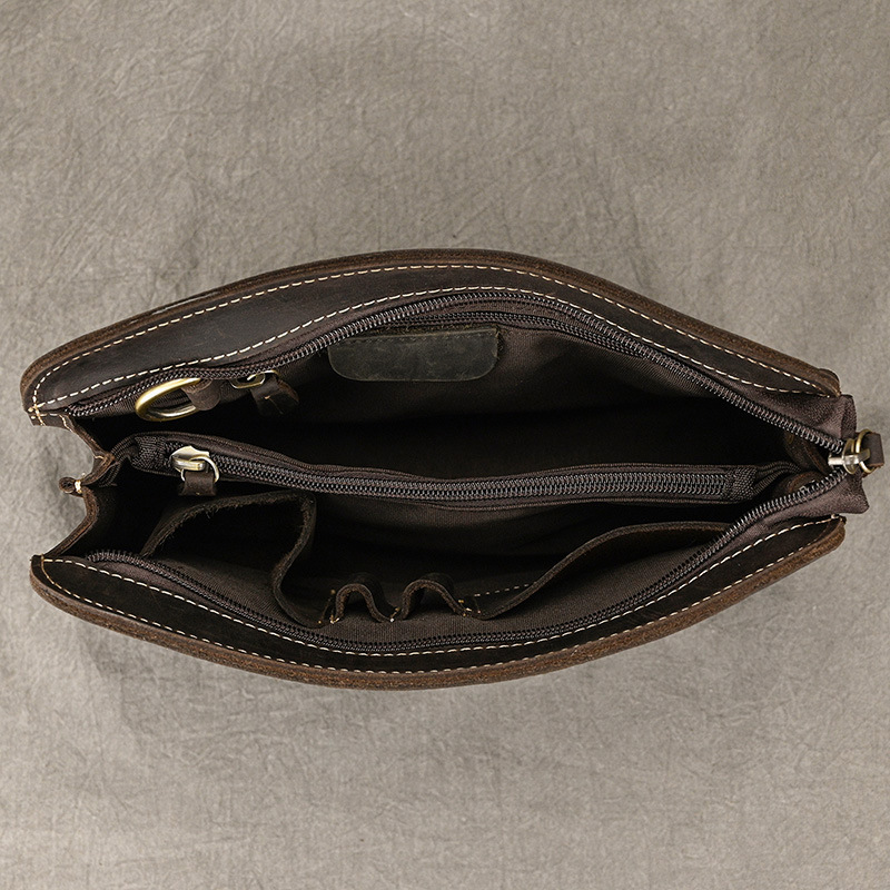 Men's Leather Zip-Up Wristlet Bag - interior showing central zipped divider, organiser pockets and pen loops