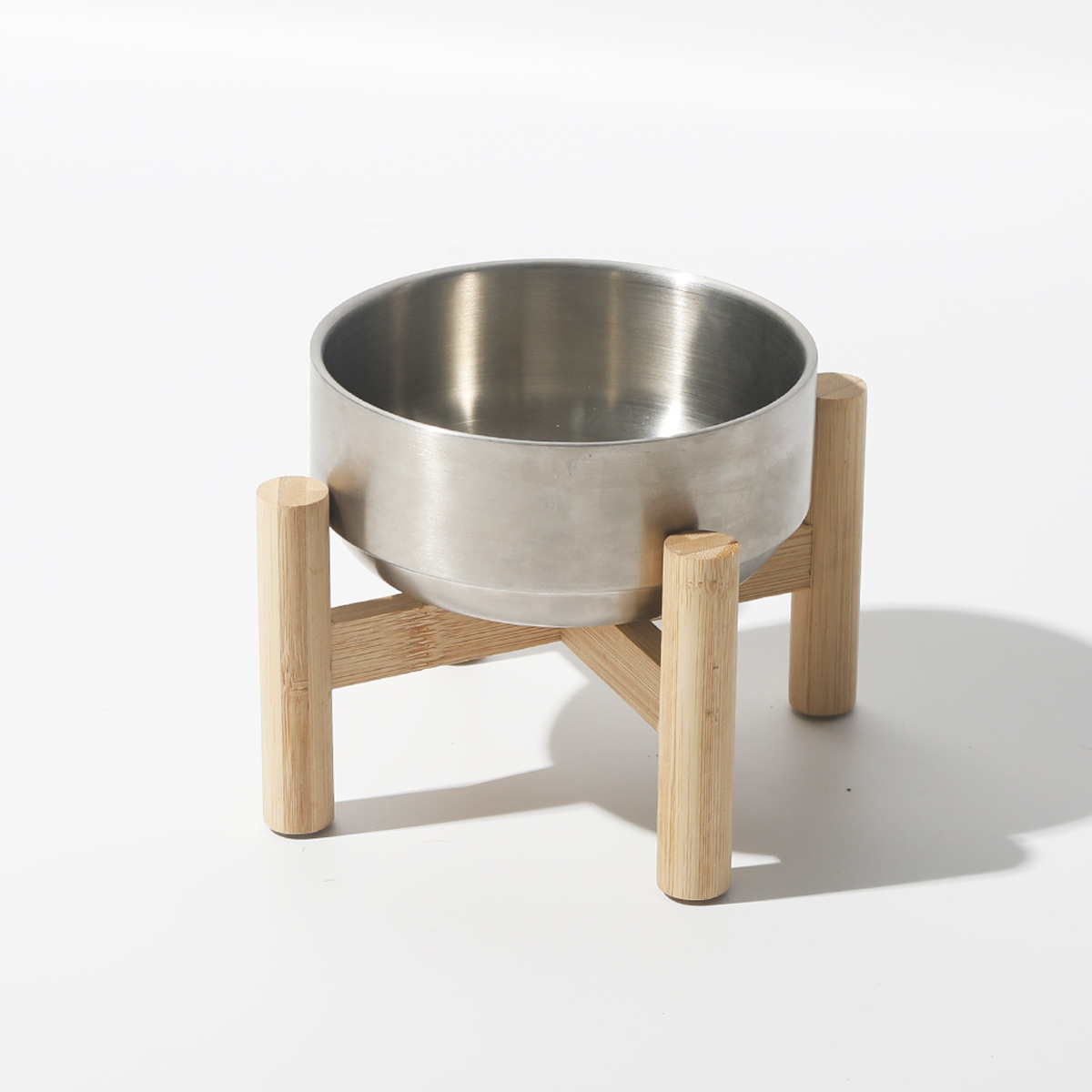 Stainless Steel Cat Bowl On A Raised Wooden Stand To Prevent Tipping