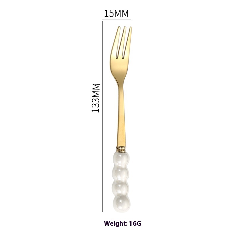 Gold Fork With White Handle