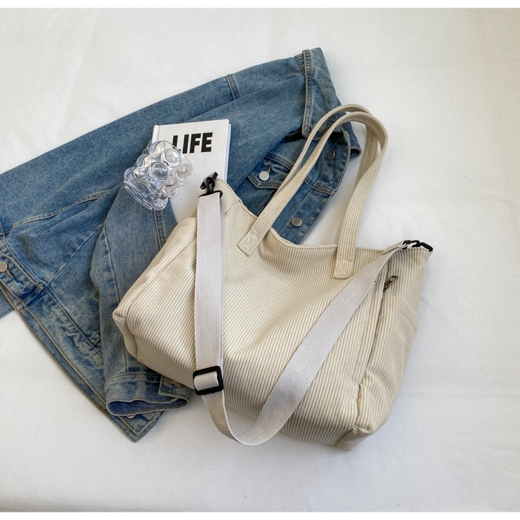 Large Capacity Art Student Shoulder Bag. Product information: Lining texture: Polyester, Applicable scenario: leisure travel, Color: creamy-white, green, black, Outer bag type: Sandwich pocket, Hardness: medium and soft, Material: corduroy, Suitcase shape