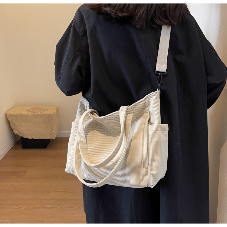 Large Capacity Art Student Shoulder Bag. Product information: Lining texture: Polyester, Applicable scenario: leisure travel, Color: creamy-white, green, black, Outer bag type: Sandwich pocket, Hardness: medium and soft, Material: corduroy, Suitcase shape