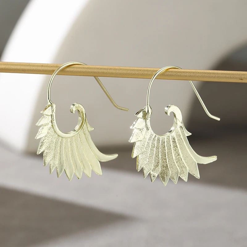 Fashionable And Creative Dangling Feather Wing Earrings