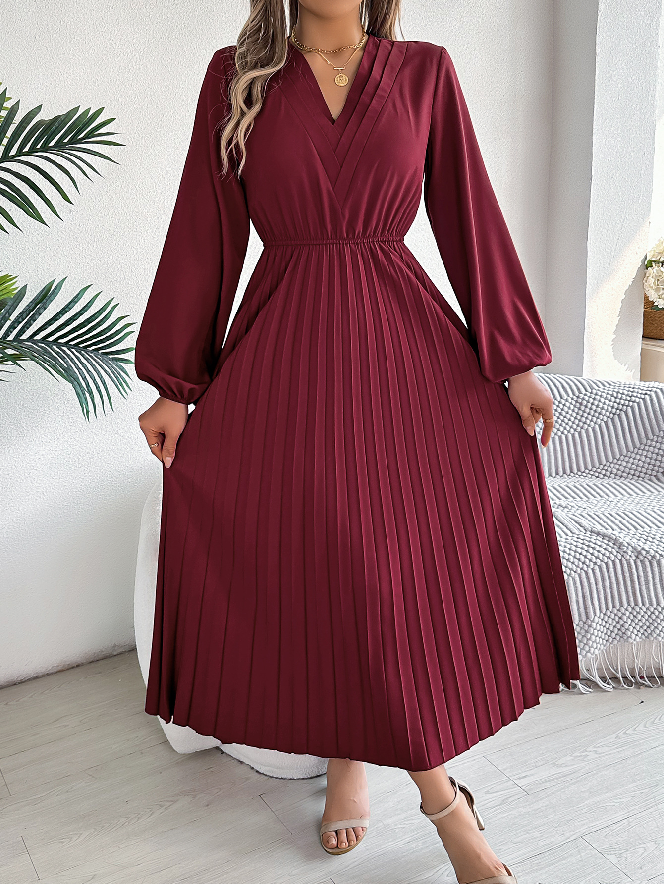 Elegant Womens Long Pleated Dress With A Triple V-Neck Long Sleeves And A Defined Waist