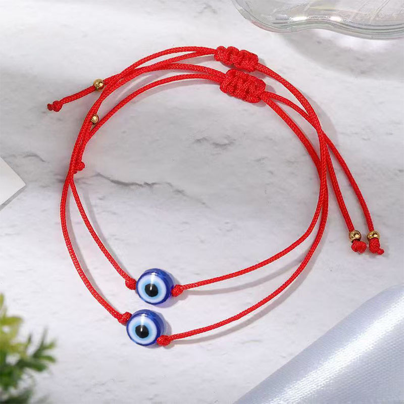 Simple Red Rope Bracelet With A Woven Evil Eye Design