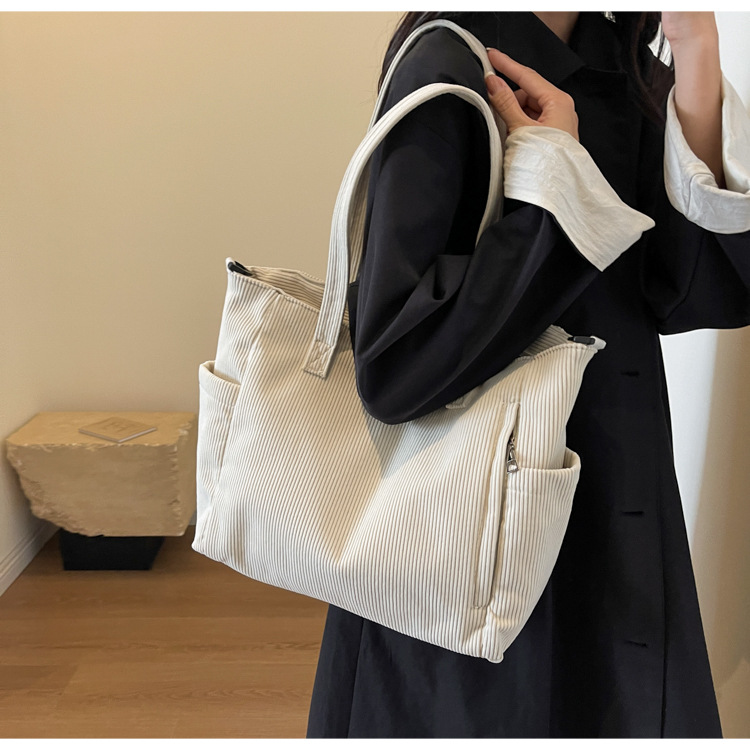 Large Capacity Art Student Shoulder Bag. Product information: Lining texture: Polyester, Applicable scenario: leisure travel, Color: creamy-white, green, black, Outer bag type: Sandwich pocket, Hardness: medium and soft, Material: corduroy, Suitcase shape