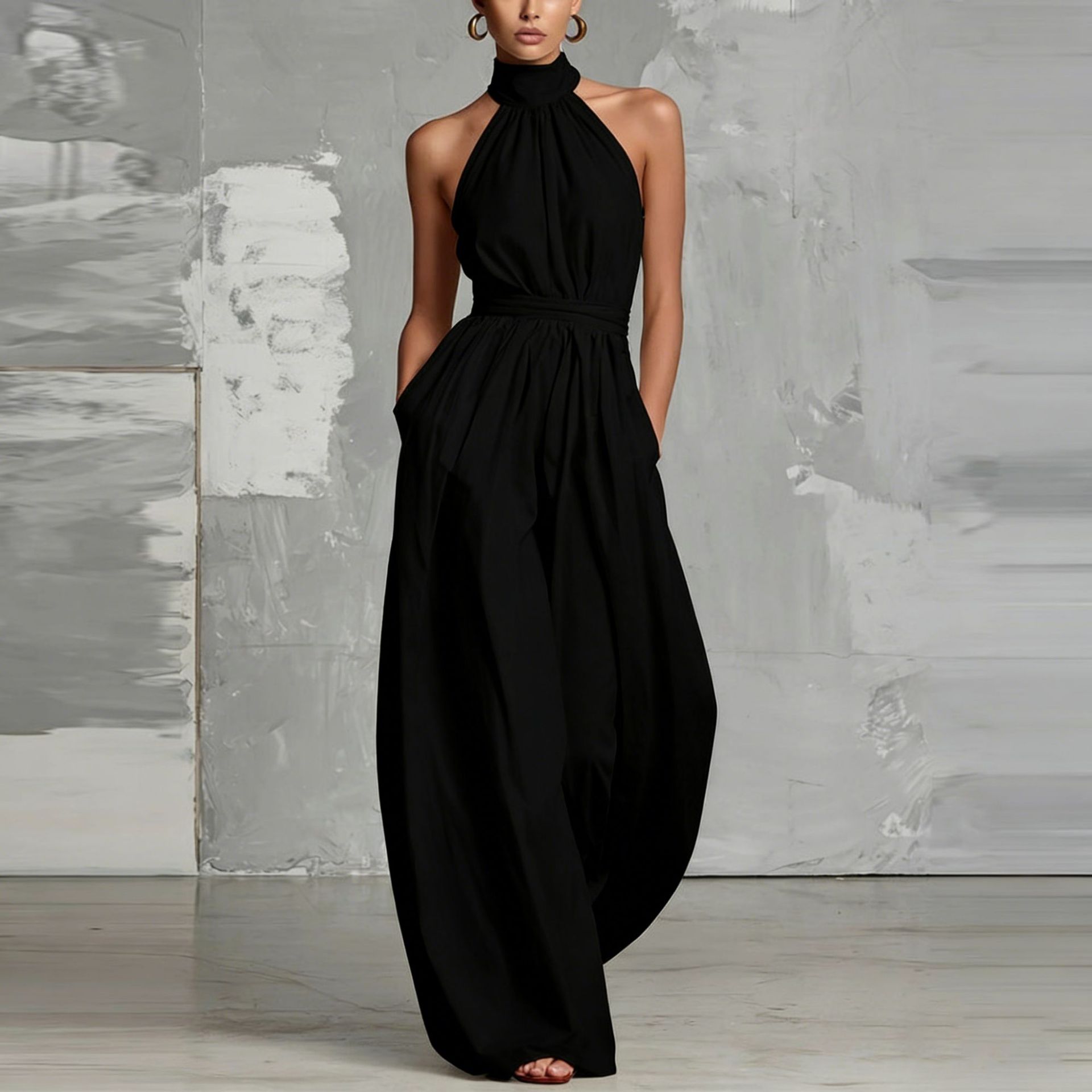 Women's sleeveless pleated jumpsuit in black – belted high-waist cinched full-length