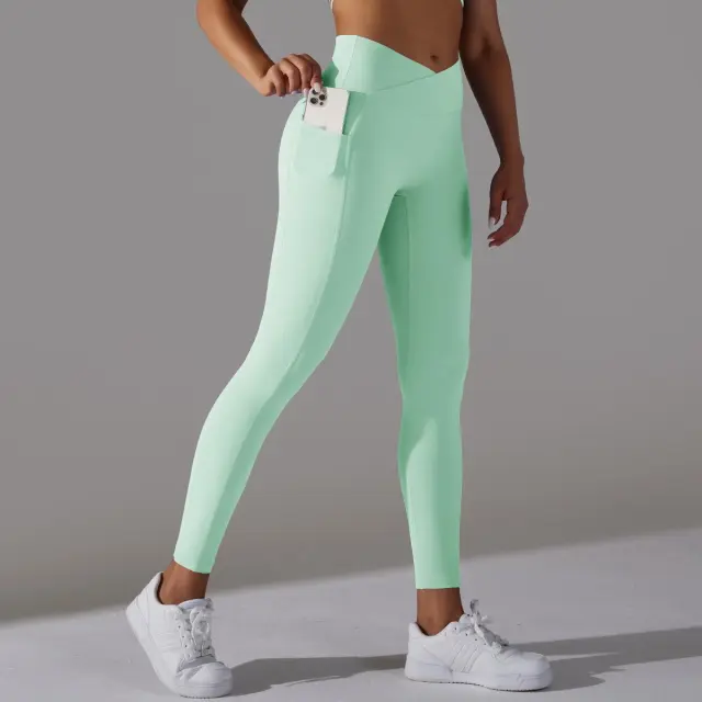 Nude Feel Skin friendly Cross Waist Pocket Stretch Fitness Sports Ninth Pants Light Green - Shop at LoveMi