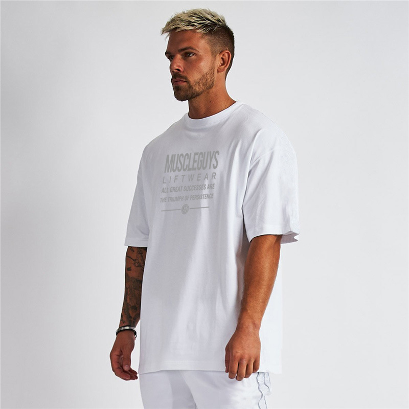Model wearing black short-sleeve tee