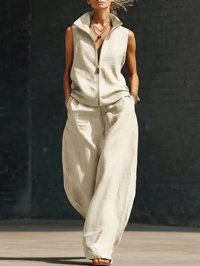 Woman in beige linen cotton two-piece set showcasing wide-leg pants and zipper closure top