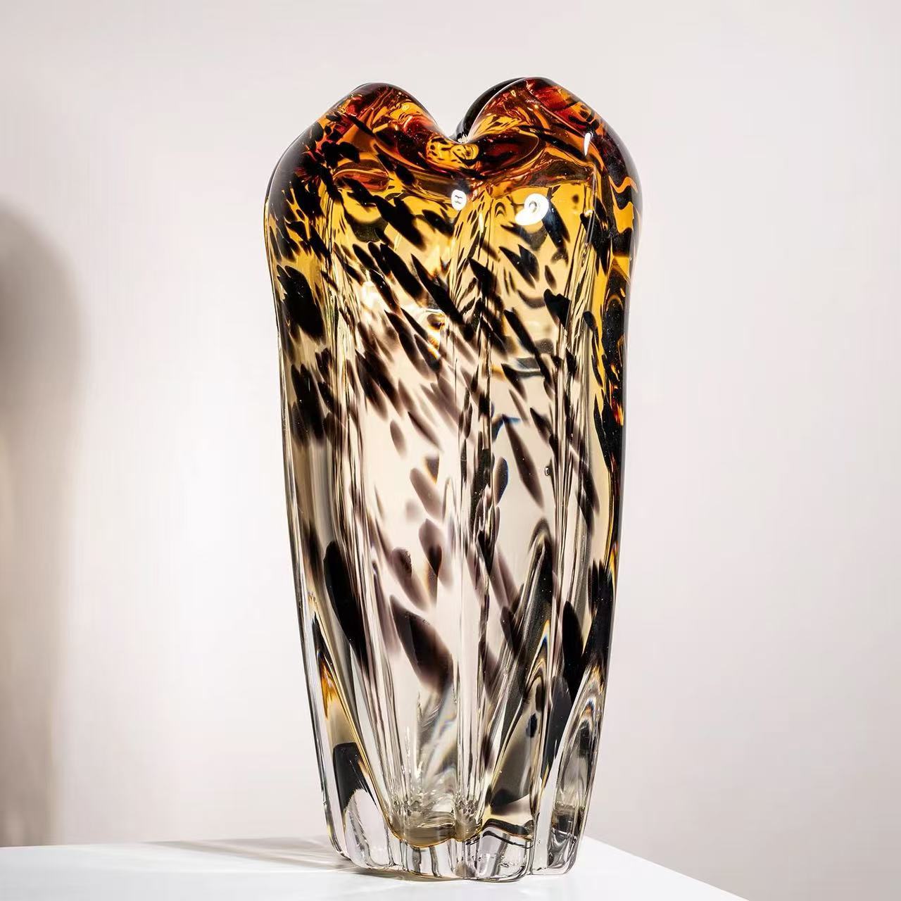 A Variety Of Modern Glass Vases And Floral Arrangements For Showroom Displays And Home Decor