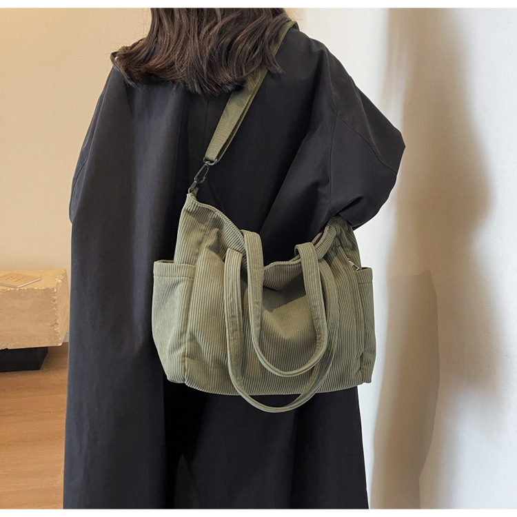 Large Capacity Art Student Shoulder Bag. Product information: Lining texture: Polyester, Applicable scenario: leisure travel, Color: creamy-white, green, black, Outer bag type: Sandwich pocket, Hardness: medium and soft, Material: corduroy, Suitcase shape