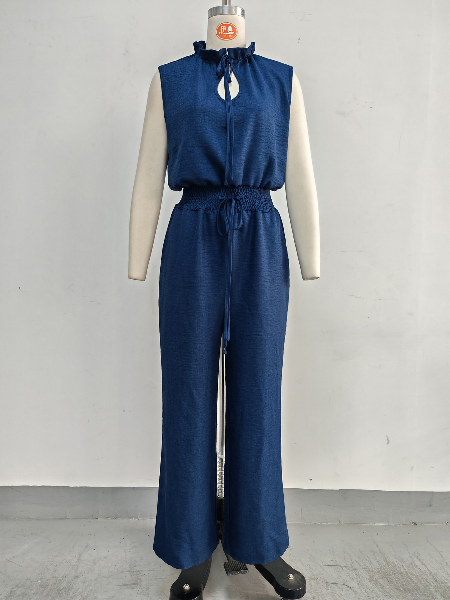 Women's sleeveless jumpsuit in apricot, casual street style lifestyle photo