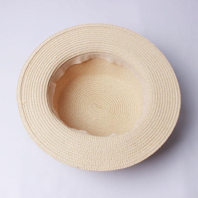 Title 6, Sun hat with bow covering the sun