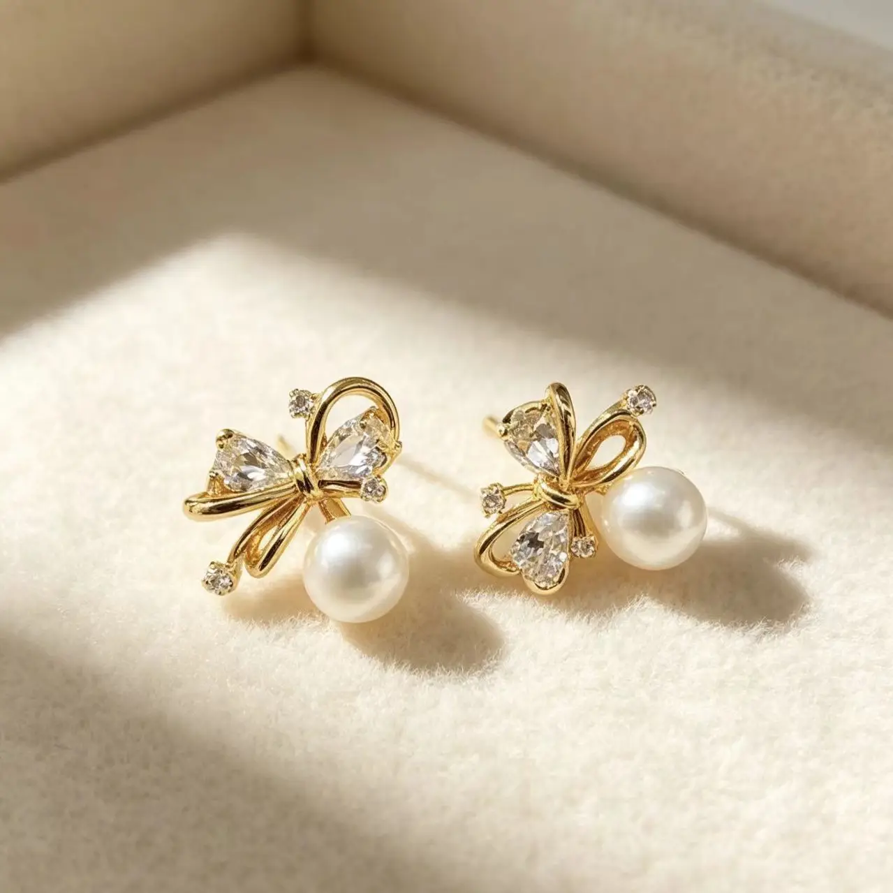 Copper-plated Silver Bow Pearl Zircon Stud Earrings
